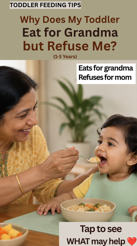 Toddler happily eating food offered by grandmother at the dining table while enjoying mealtime with a caregiver.