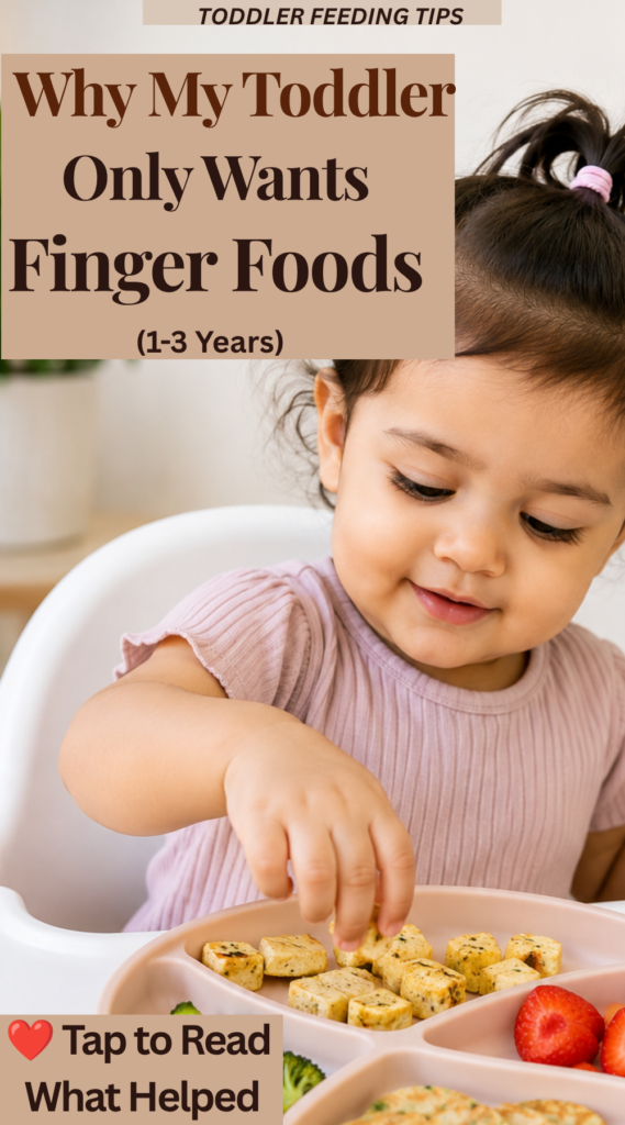 Why My Toddler Only Wants Finger Foods (1–3 Years) Toddler happily picking up small pieces of food with their fingers from a divided plate, illustrating a common self-feeding stage where toddlers prefer finger foods over utensils.