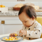 What I Serve My Toddler When She Refuses Dinner (1–3 Years) Toddler refusing dinner while sitting at the dining table, with easy toddler dinner ideas and meal solutions for picky eaters aged 1–3 years.