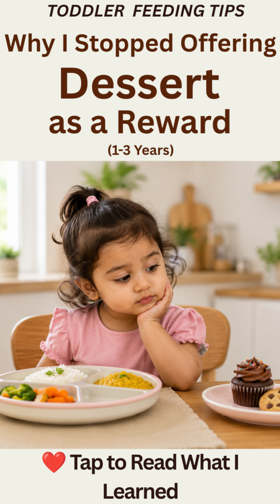 Why I Stopped Offering Dessert as a Reward (1–3 Years) Toddler sitting at the table with a healthy meal while looking at a cupcake and cookie on a separate plate, illustrating why using dessert as a reward can influence toddler eating habits.