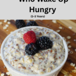 7 Filling Breakfasts for Toddlers Who Wake Up Hungry (1–3 Years) Toddler breakfast plate with mini pancakes, banana slices, blueberries, strawberries, and milk, featuring easy breakfast ideas for toddlers aged 1–3 years.
